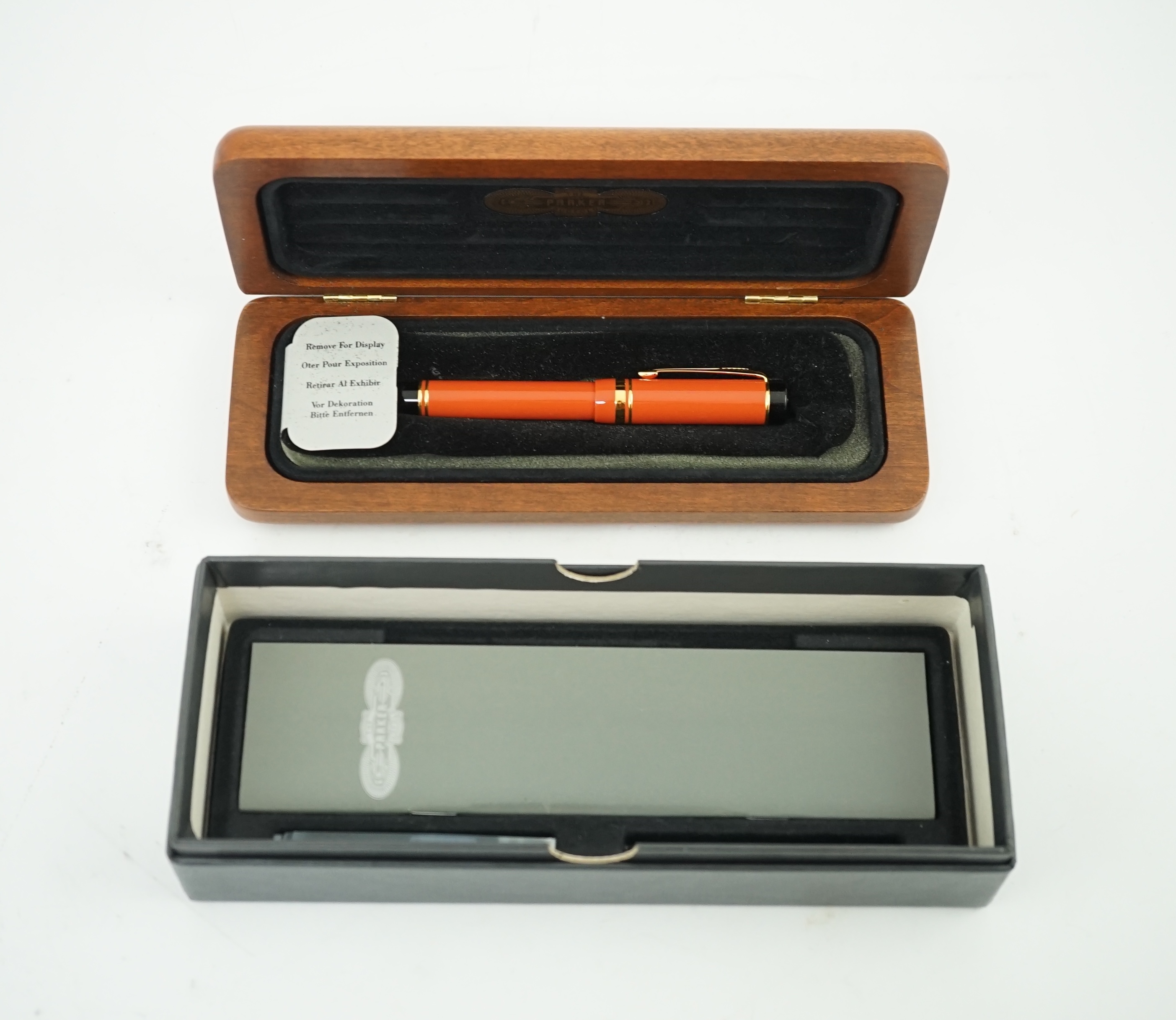 A Parker Duofold orange international fountain pen, in cherry wood presentation case